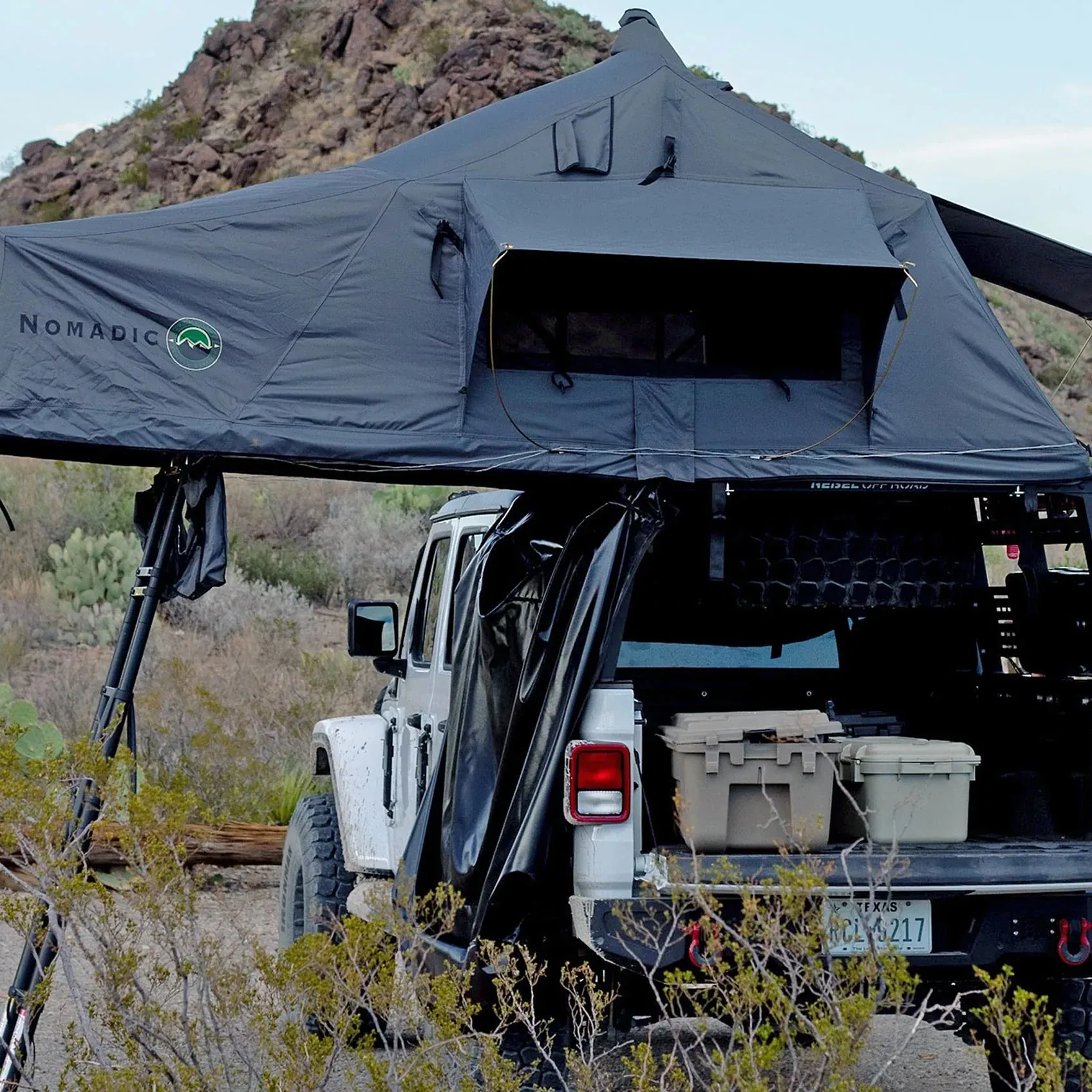 OVS Nomadic rooftop tent set up on a Jeep in the desert