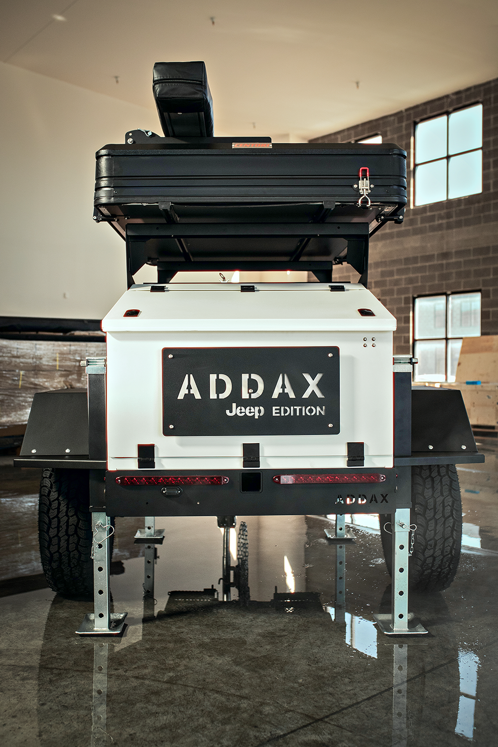 Jim Morrison, Head of Jeep Performance Parts, alongside the Jeep Gladiator Overlanding Camper by ADDAX