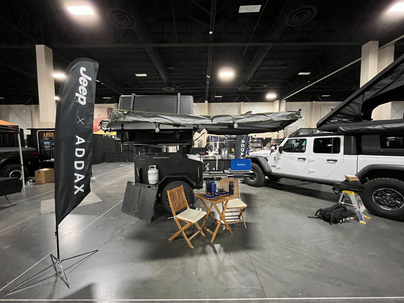 ADDAX trailer on display at SLOREX with the Jeep x ADDAX flag